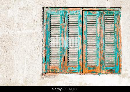 window in wall with old wooden shutters Stock Photo