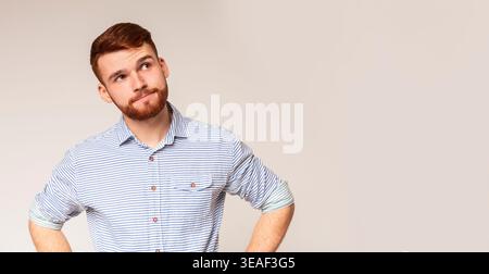 Thoughtful man looking away at copy space Stock Photo