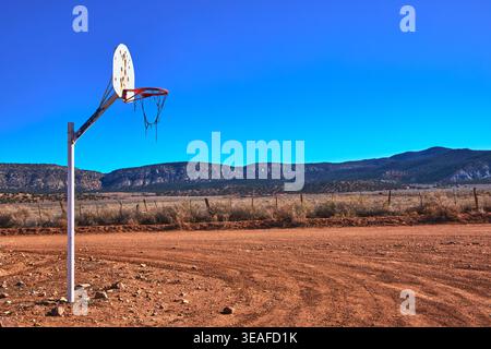 Basketball Hoop on Dirt Court with Mount Trumbull and Arizona Desert Landscape Stock Photo