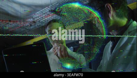 Pointing two researchers in lab coats analyzing hologram and data readout in dim lab, laptop Stock Photo