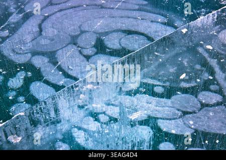 Frozen Methane Bubbles and Cracked Ice Texture Winter Abstract Close Up Stock Photo