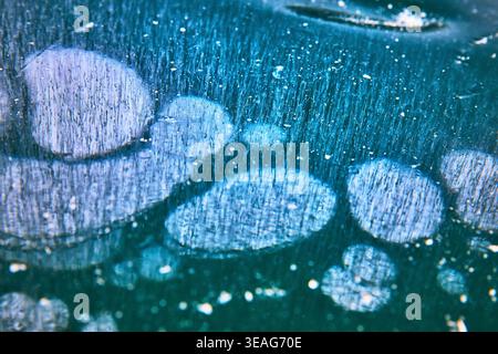 Frozen Methane Bubbles and Abstract Patterns in Winter Lake Ice Close Up Stock Photo
