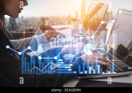 A business professional works on a laptop in an urban office, analyzing financial data through graphs and charts, visualizing growth and strategies. S Stock Photo