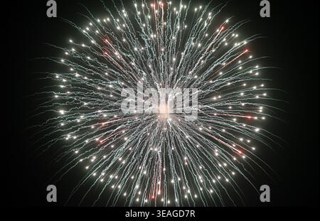 Fireworks explode in the night. Stock Photo