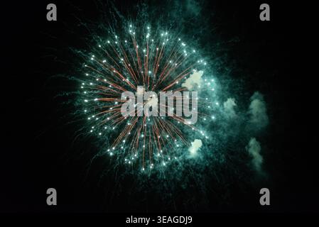 Fireworks explode in the sky. Stock Photo