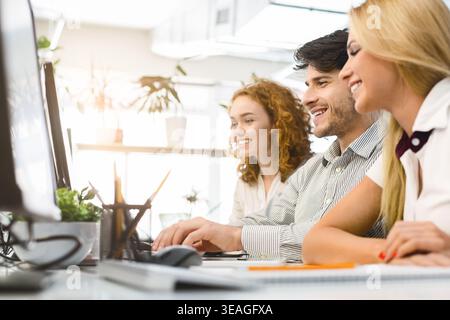 Colleagues Collaborating in a Modern Office During a Productive Meeting Stock Photo