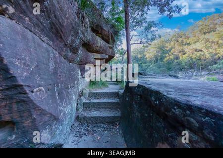The fabricated stone walkway leading to the highly visited Jellybean Pool and Glenbrook Creek waterway near the Blue Mountains town of Glenbrook in Ne Stock Photo