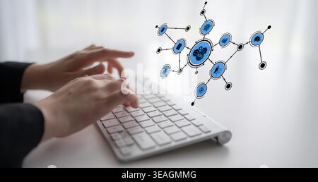 A close-up view of hands typing on a keyboard with a floating digital network above, symbolizing connections and technology in a modern workspace. Tes Stock Photo