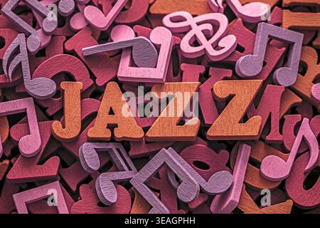 Inscription jazz on pile of colorful wooden letters and musical notes Stock Photo