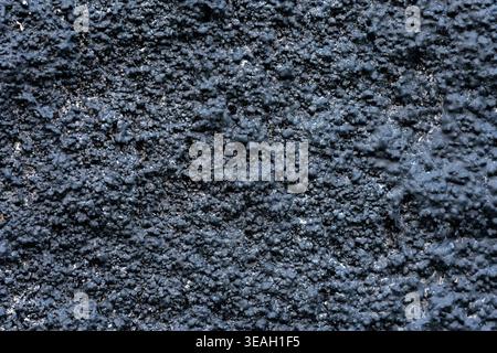 Abstract Dark Black and Navy Blue Gritty Wall Texture Background with Coarse Rough Surface, Industrial or Grunge Background: Seamless Pattern of Rough Stock Photo