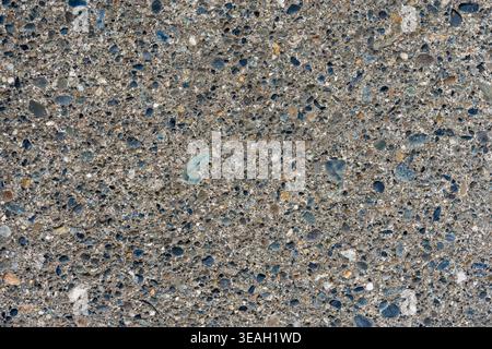 Durable Outdoor Surface Background: Detailed Texture of Granular Concrete with Embedded Stones Stock Photo