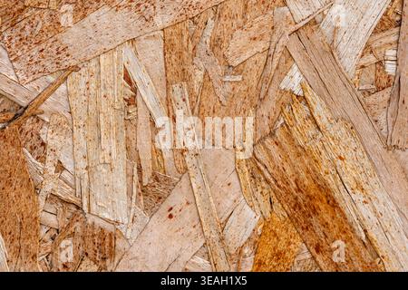 Abstract Wood Chip Texture Moving Down | Engineered Lumber Background, Brown Wooden Surface Texture | Construction OSB Board Panning Stock Photo