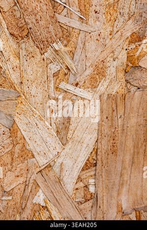 Full Frame Texture of Oriented Strand Board (OSB) Plywood with Wooden Flakes and Chips Stock Photo