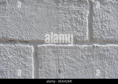 Minimalist Construction Background: Seamless Pattern of White Mortar and Textured Bricks Stock Photo