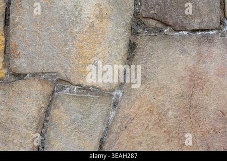 Irregular Flagstone Pavement Texture: Large Natural Stone Slabs in Earthy Gray and Tan Tones Stock Photo