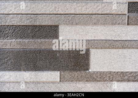 Modern Gray and White Horizontal Rectangular Tile Wall Texture Background with Varying Shades Stock Photo