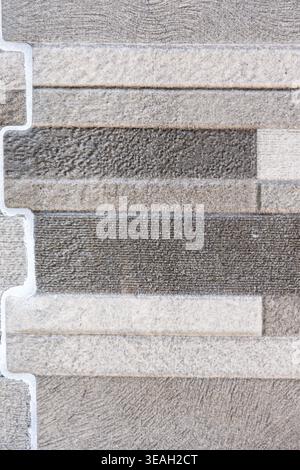 Contemporary Architecture Background: Seamless Pattern of Gray Stacked Bricks or Stone Veneer Stock Photo