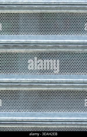 Security Screen Texture: Full Frame View of Industrial Metal Mesh and Solid Panels Stock Photo