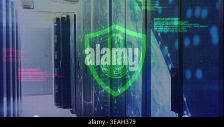 Projecting green shield with padlock and fingerprint hovering over server racks in data center Stock Photo