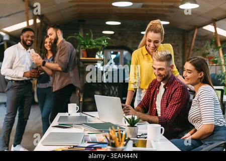 Group Collaboration in Modern Workspace Focused on Creative Project Stock Photo