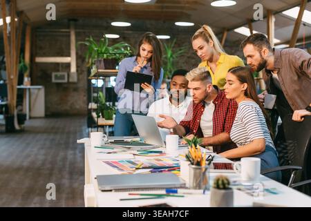 Startup concept. Young colleagues working on new project Stock Photo