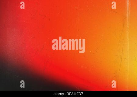 Abstract red and orange film grain background with light leaks and scratch effects Stock Photo