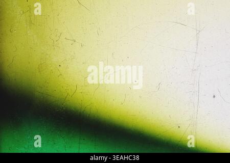 Green and yellow gradient vintage texture with dark vignette and film scratches Stock Photo