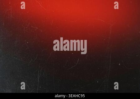 Grungy black textured background with dust scratches and a bright red top gradient glow Stock Photo