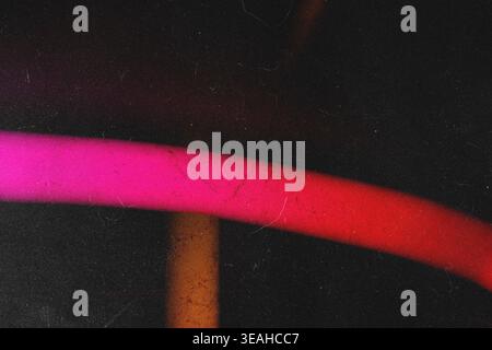 Vibrant pink and red glowing curved light trail over dark grunge scratch texture Stock Photo