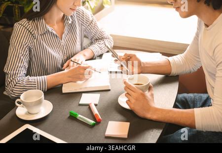 Colleagues working remotely on creative project in informal meeting Stock Photo