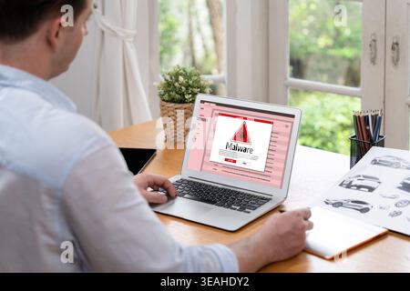 Cyber attacking concept. Malware alert showing on computer screen display scam and threat detection on computer system or online server to be removed Stock Photo