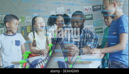 Showing teacher teaching on tablet at school while six children lean in, with abacus Stock Photo