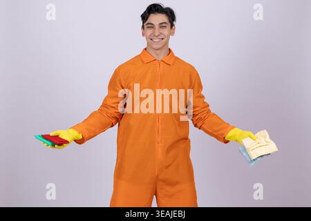 Worker in orange coveralls gesturing with hands Stock Photo