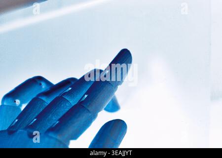 Close-up of a robotic hand pointing isolated on a white background with copy space. Futuristic concept of artificial intelligence and human-machine in Stock Photo