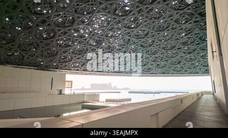 Abu Dhabi, United Arab Emirates - August 18, 2024: The image showcases the intricate ceiling design of the Louvre Abu Dhabi, featuring a geometric pat Stock Photo