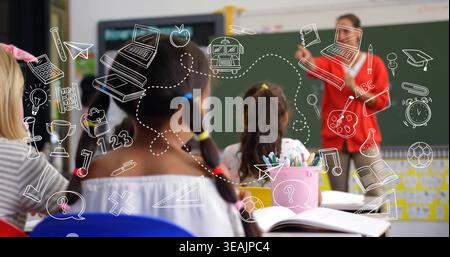 Pointing teacher in red top gesturing toward green chalkboard at classroom, open textbook, doodles Stock Photo