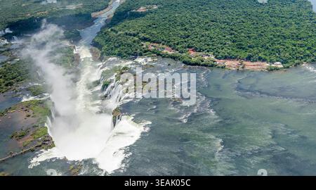 panoramic aerial landscape, from an helicopter, with Iguazu river large waterfalls in  subtropical rain forest, shot from south in bright summer light Stock Photo