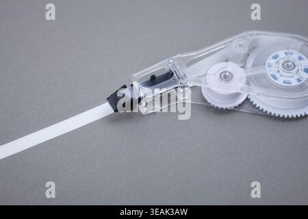 correction tape on grey background Stock Photo