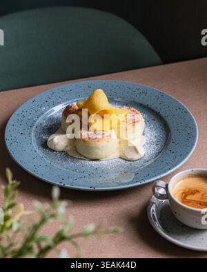 Sophisticated Egg Dish Served Beautifully. Refined Eggs Benedict With Creamy Sauce And Stylish Setting Stock Photo
