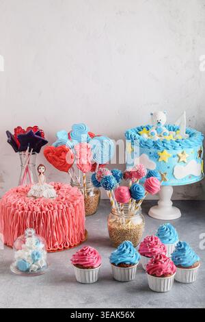 Decorative Treats Display With Playful Designs. Assorted Pastel Confections Arranged On Tiered Stands Stock Photo
