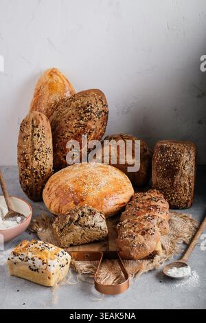 Artful Display Of Bread And Accompaniments. Rustic Bread Slices Arranged With Butter And Grains Stock Photo