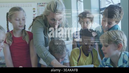 Leaning teacher in green blouse guiding seven children around laptop in classroom, projected charts. Instructor, students, education, learning, collab Stock Photo