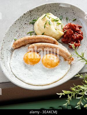 Breakfast With Eggs. Hearty Breakfast With Sausages. Warm Morning Meal With Eggs And Sides Stock Photo