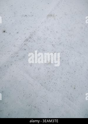 Close-up of worn white fabric surface marked with dirt, scratches, and stains. Ideal for backgrounds and concepts of wear, neglect, cleaning, material Stock Photo