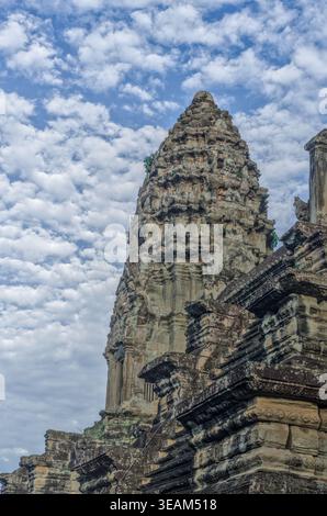 Angkor Wat towers photographed against an extraordinary mackerel cloud sky, Cambodia, in a dramatic landscape composition. Stock Photo