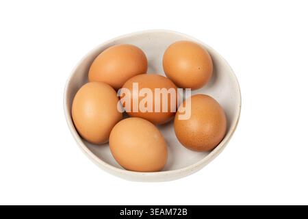 Plate full of raw chicken eggs isolated on white background Stock Photo