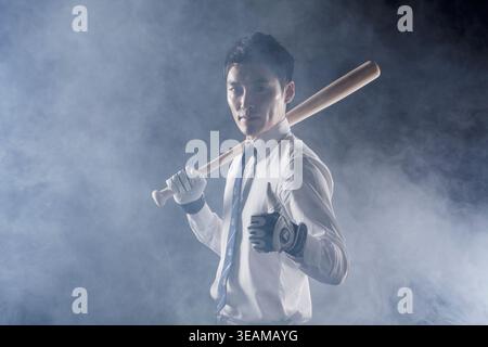 Business man posing with a baseball bat Stock Photo