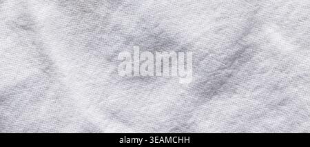 Crumpled white cotton fabric texture with soft folds for a natural linen background Stock Photo