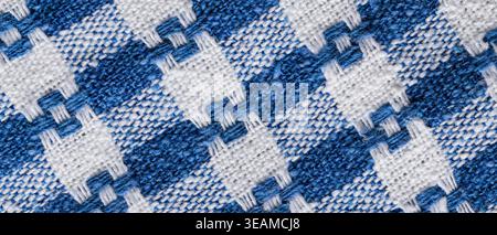 Blue and white woven gingham fabric texture background with checkered pattern for country rustic backdrop Stock Photo