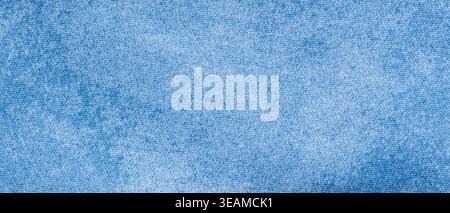Washed light blue denim fabric texture background with faded cotton weave for casual apparel backdrop Stock Photo